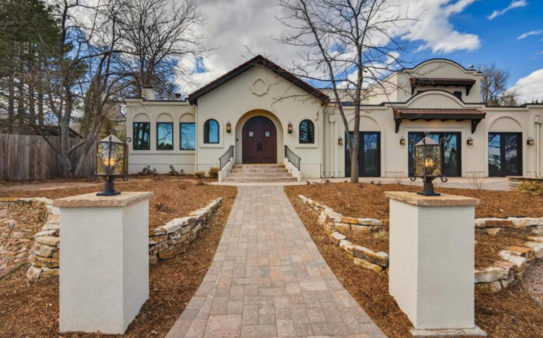 beautiful spanish style home with large front door entry way